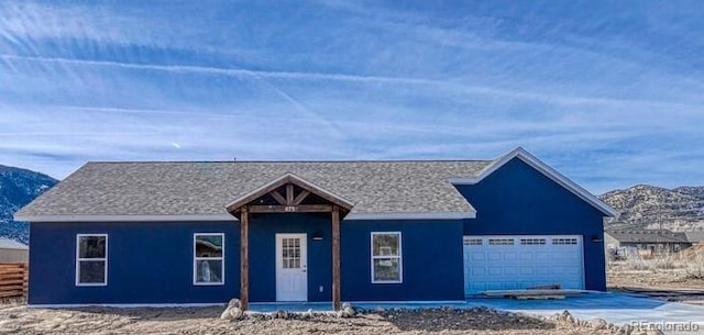 880 Hoover Cir, Poncha Springs, CO 81242 - ranch-style home featuring a garage, concrete driveway, a mountain view, and fence