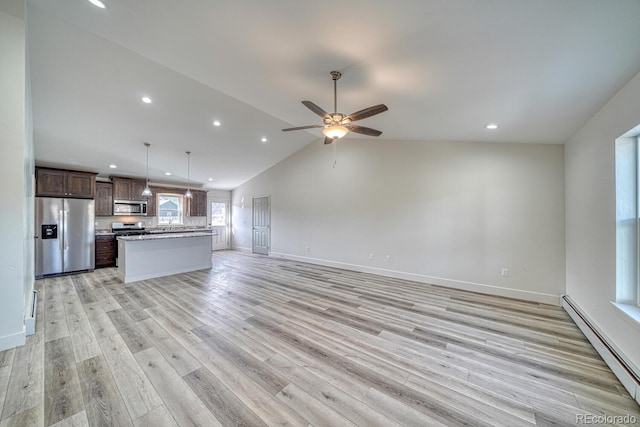 880 Hoover Cir, Poncha Springs, CO 81242 - unfurnished living room with a ceiling fan, light wood-type flooring, lofted ceiling, baseboards, and a baseboard heating unit