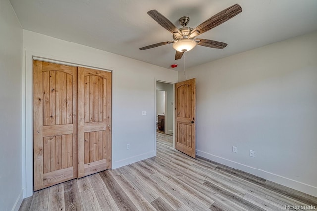 880 Hoover Cir, Poncha Springs, CO 81242 - unfurnished bedroom with light wood finished floors, baseboards, a closet, and a ceiling fan