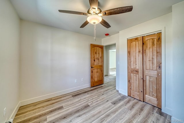 880 Hoover Cir, Poncha Springs, CO 81242 - unfurnished bedroom featuring a ceiling fan, a closet, baseboards, and light wood-style floors