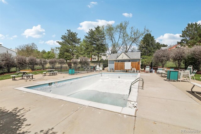 6722 S Independence St, Littleton, CO 80128 - community pool with fence, a patio area, and an outdoor structure