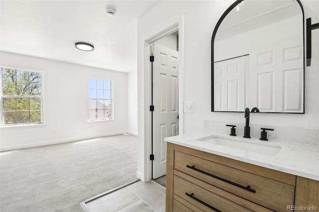 6722 S Independence St, Littleton, CO 80128 - bathroom featuring vanity and baseboards