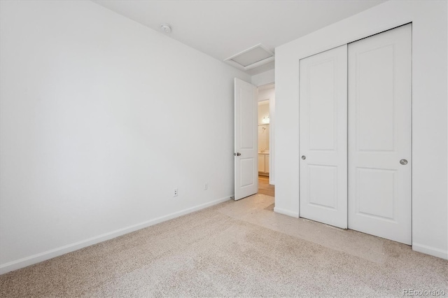 24780 E 39th Ave, Aurora, CO 80019 - unfurnished bedroom featuring attic access, light carpet, baseboards, and a closet