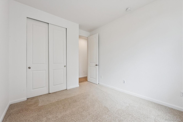 24780 E 39th Ave, Aurora, CO 80019 - unfurnished bedroom featuring carpet flooring, baseboards, and a closet