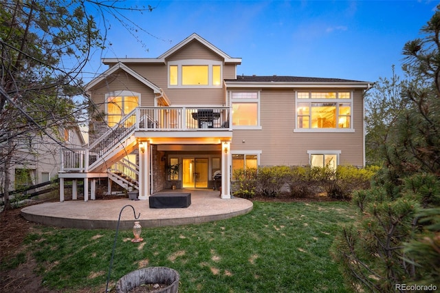 back of property featuring a patio, a lawn, stairway, and a deck