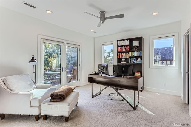 carpeted home office featuring ceiling fan and french doors