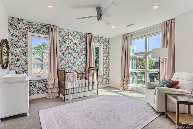 carpeted bedroom featuring ceiling fan