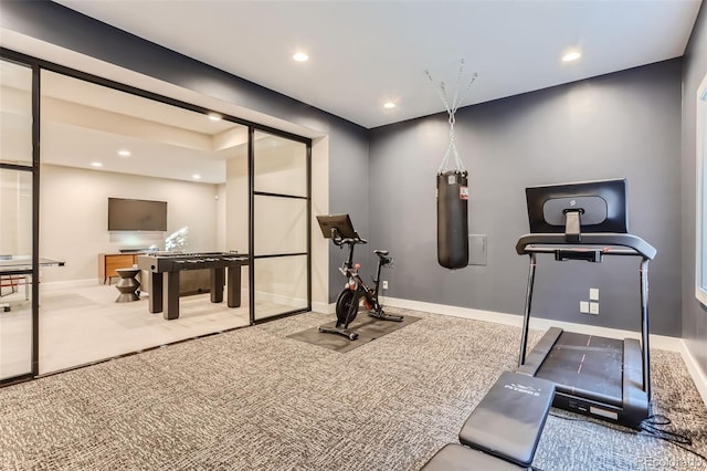 exercise room featuring carpet flooring