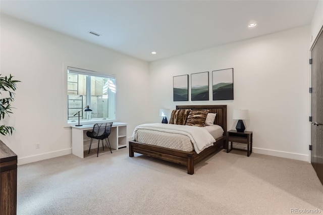 bedroom featuring light colored carpet