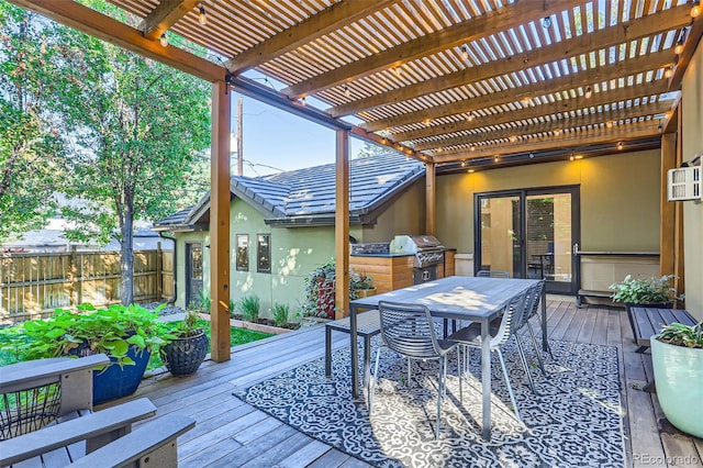 wooden terrace with a pergola and area for grilling