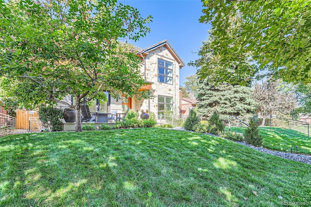 view of front of home with a front yard