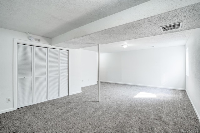 1366 Firefly Cir, Colorado Springs, CO 80916 - finished basement with carpet, a textured ceiling, and baseboards