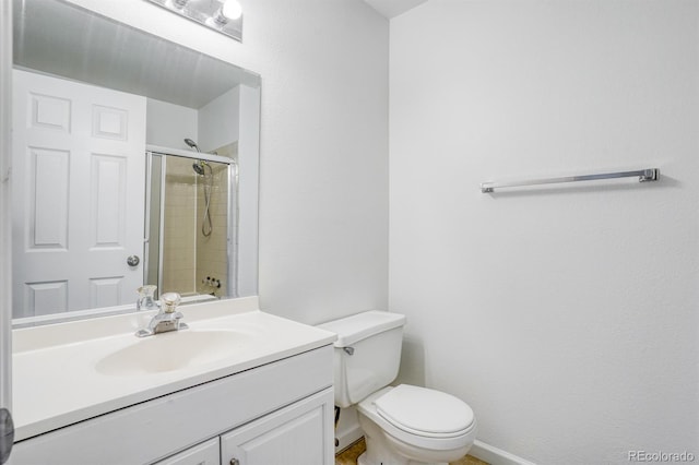 1366 Firefly Cir, Colorado Springs, CO 80916 - bathroom with tiled shower, toilet, vanity, and baseboards