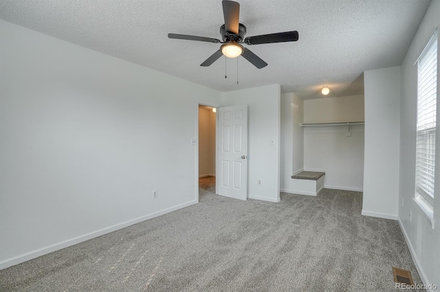1366 Firefly Cir, Colorado Springs, CO 80916 - unfurnished bedroom featuring a textured ceiling, a closet, carpet floors, baseboards, and a ceiling fan