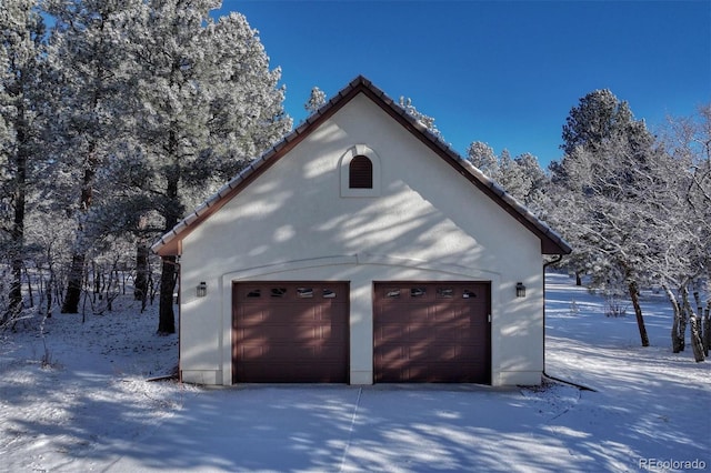 view of snow covered garage