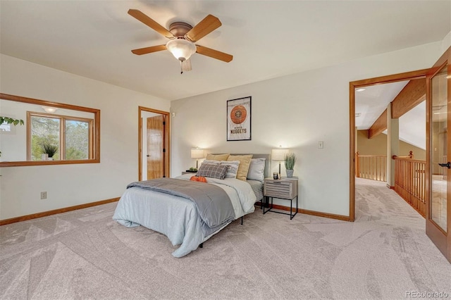 bedroom featuring light carpet, ceiling fan, lofted ceiling with beams, and baseboards