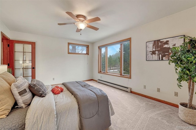 bedroom featuring a ceiling fan, baseboards, baseboard heating, and light carpet