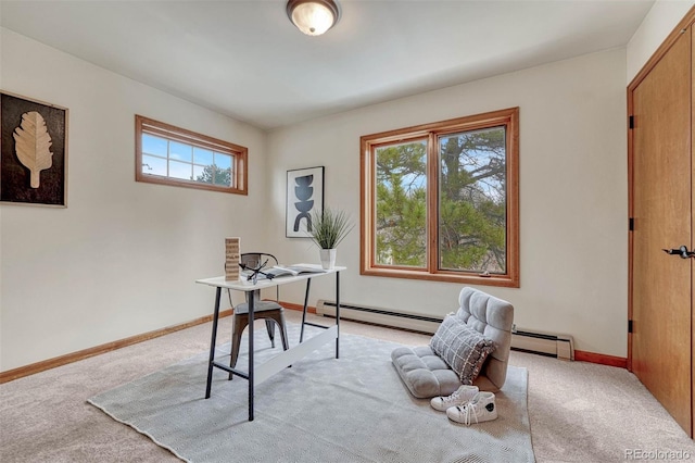 office space with baseboards, light carpet, and a baseboard heating unit