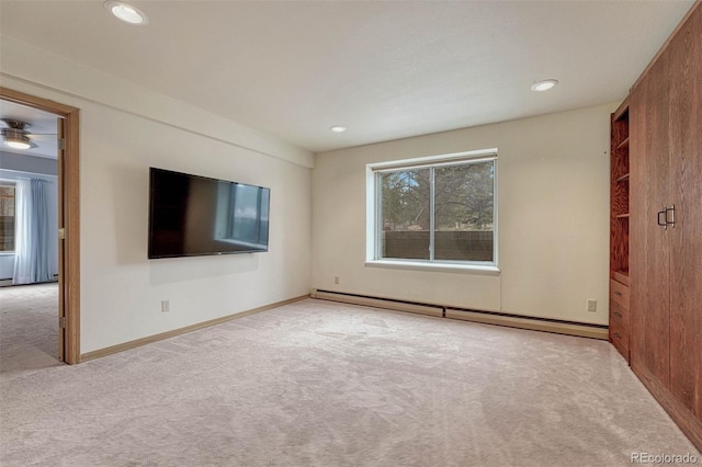 empty room with recessed lighting, a baseboard heating unit, baseboards, and carpet flooring