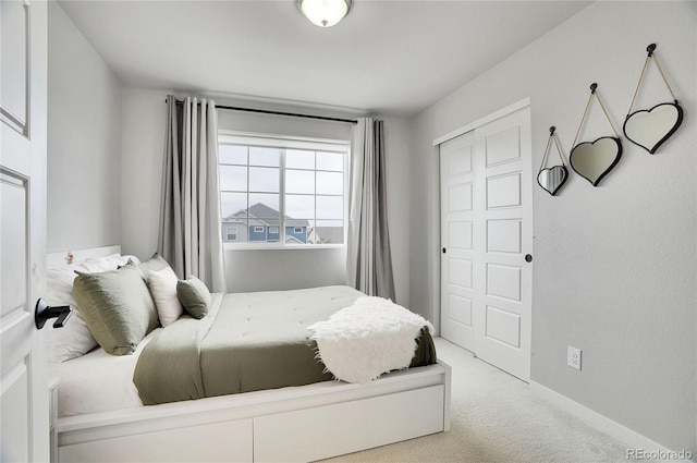 carpeted bedroom with a closet