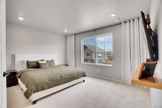 bedroom with light colored carpet