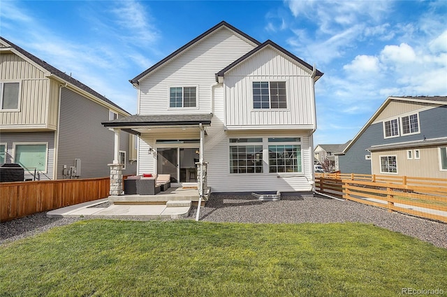 back of house featuring a yard and a patio area