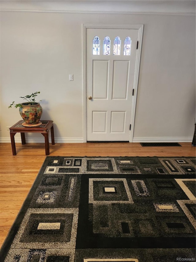 foyer with hardwood / wood-style floors