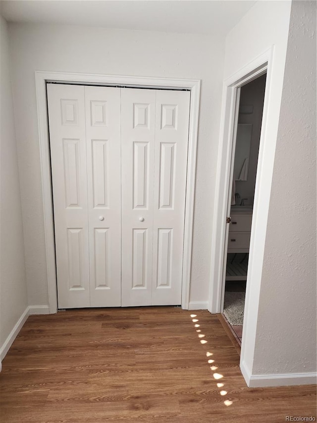 corridor featuring hardwood / wood-style floors