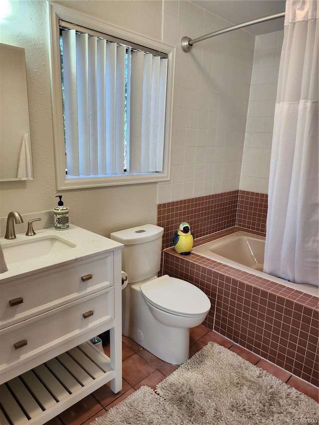 full bathroom with toilet, shower / bath combo with shower curtain, tile patterned floors, and vanity