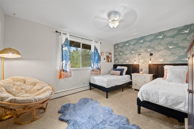 29663 Paint Brush Dr, Evergreen, CO 80439 - bedroom featuring baseboard heating, wallpapered walls, carpet floors, a ceiling fan, and an accent wall