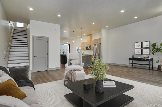 6450 Cleora Rd Unit C, Salida, CO 81201 - living room with wood finished floors, stairs, recessed lighting, and baseboards