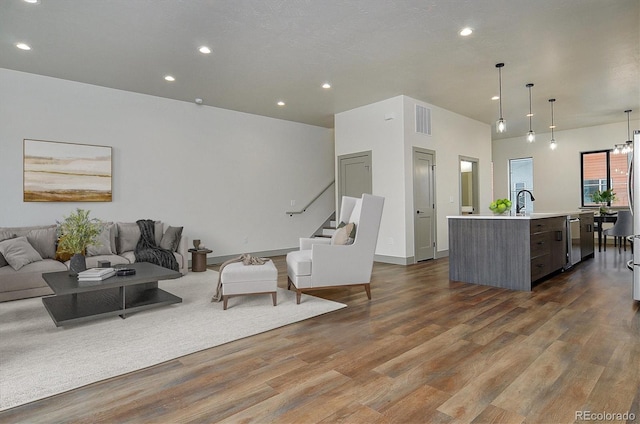 6450 Cleora Rd Unit C, Salida, CO 81201 - living area featuring dark wood-style floors, recessed lighting, and stairs