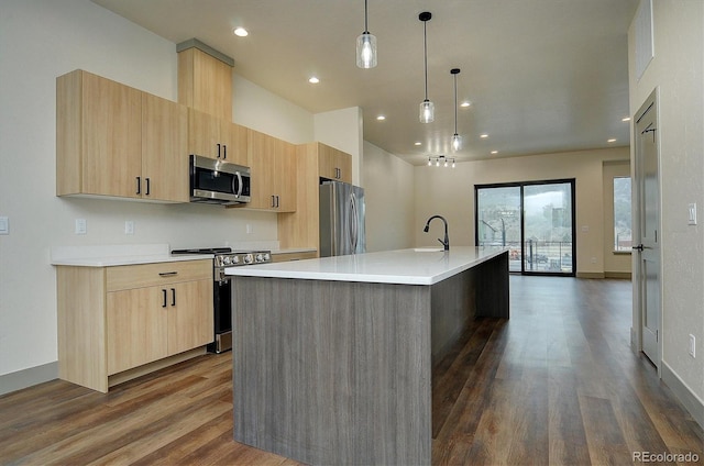 6450 Cleora Rd Unit C, Salida, CO 81201 - kitchen featuring appliances with stainless steel finishes, light brown cabinetry, dark wood finished floors, light countertops, and recessed lighting