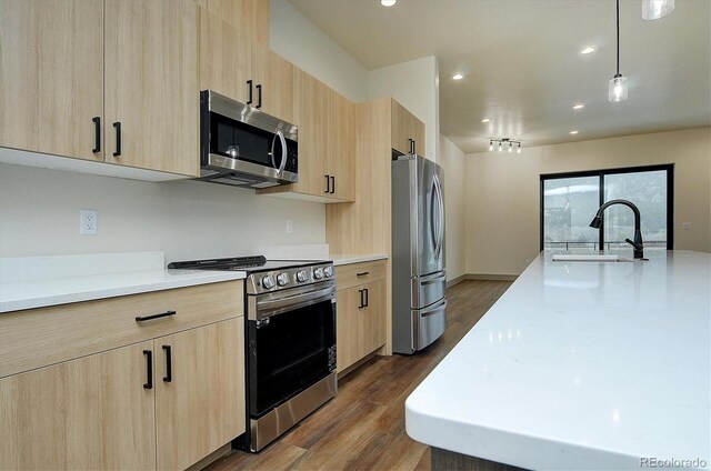 6450 Cleora Rd Unit C, Salida, CO 81201 - kitchen featuring light brown cabinetry, stainless steel appliances, a sink, light countertops, and recessed lighting