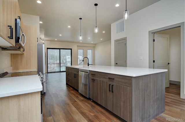 6450 Cleora Rd Unit C, Salida, CO 81201 - kitchen featuring a sink, appliances with stainless steel finishes, dark wood-style floors, a large island with sink, and recessed lighting