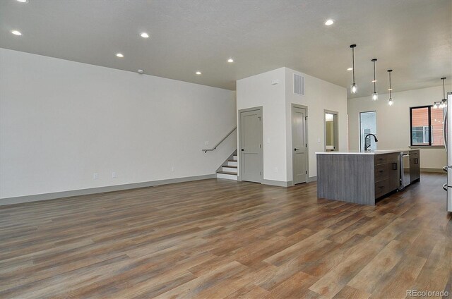6450 Cleora Rd Unit C, Salida, CO 81201 - kitchen featuring open floor plan, a kitchen island with sink, dark wood-style flooring, and recessed lighting