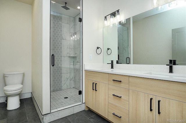 6450 Cleora Rd Unit C, Salida, CO 81201 - bathroom with a shower stall, double vanity, toilet, and baseboards