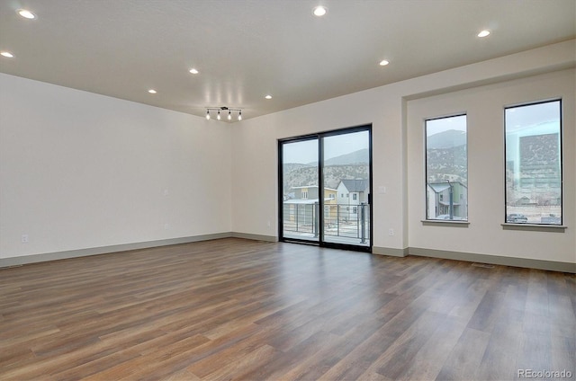 6450 Cleora Rd Unit C, Salida, CO 81201 - unfurnished room featuring wood finished floors, recessed lighting, and baseboards