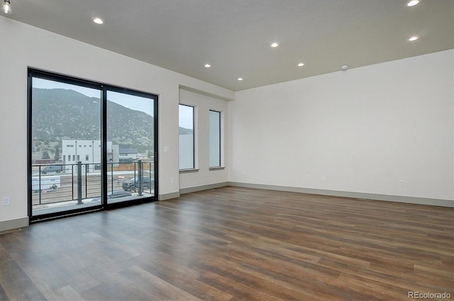 6450 Cleora Rd Unit C, Salida, CO 81201 - empty room featuring plenty of natural light, wood finished floors, baseboards, and recessed lighting