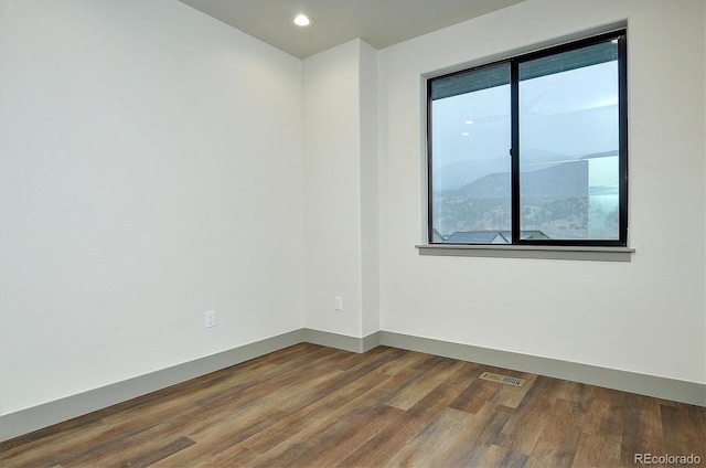 6450 Cleora Rd Unit C, Salida, CO 81201 - empty room featuring healthy amount of natural light, dark wood-style floors, recessed lighting, and baseboards