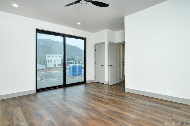 6450 Cleora Rd Unit C, Salida, CO 81201 - empty room featuring a ceiling fan, wood finished floors, recessed lighting, and baseboards