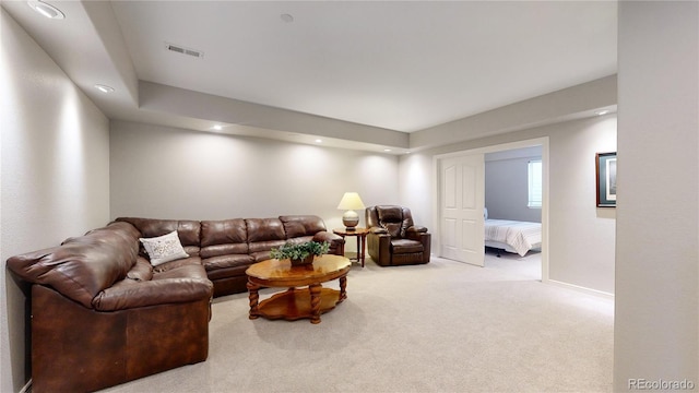 living room featuring light colored carpet