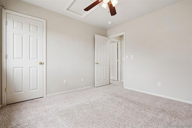 9579 Bighorn Way, Littleton, CO 80125 - unfurnished bedroom featuring carpet flooring, attic access, and a ceiling fan