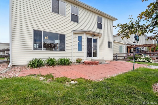 9579 Bighorn Way, Littleton, CO 80125 - rear view of house featuring a patio area and a lawn