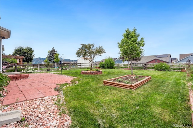 9579 Bighorn Way, Littleton, CO 80125 - fenced backyard with a garden and a patio