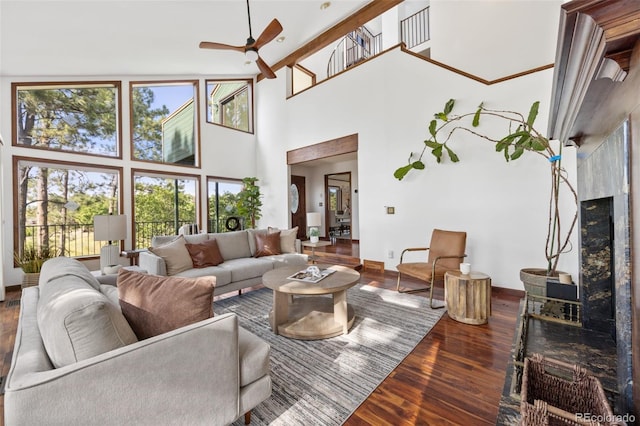 6207 Elbert Pl, Parker, CO 80134 - living room featuring a towering ceiling, ceiling fan, and wood finished floors
