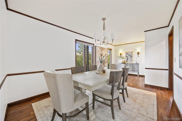 6207 Elbert Pl, Parker, CO 80134 - dining space featuring a chandelier, wood finished floors, and crown molding