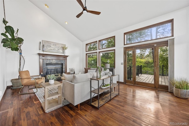 6207 Elbert Pl, Parker, CO 80134 - living area featuring high vaulted ceiling, ceiling fan, a high end fireplace, wood-type flooring, and recessed lighting