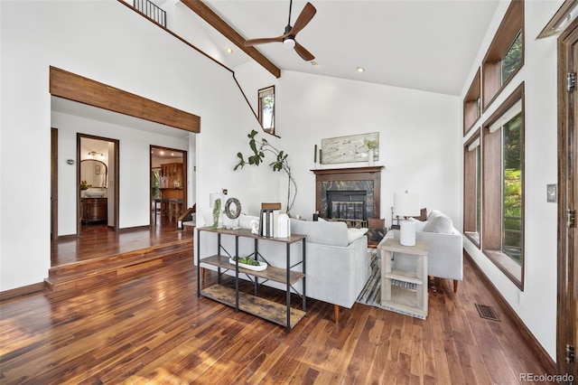 6207 Elbert Pl, Parker, CO 80134 - living room featuring hardwood / wood-style flooring, a fireplace, high vaulted ceiling, a ceiling fan, and beamed ceiling
