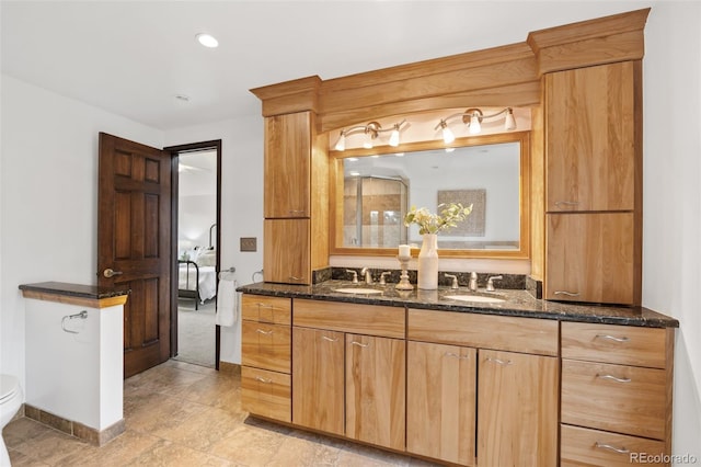 6207 Elbert Pl, Parker, CO 80134 - full bath featuring double vanity, ensuite bath, and recessed lighting